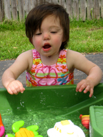 Braelynn playing in the water