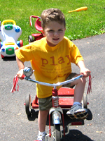 Owen riding his bike at Small Wonders