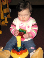 Braelynn playing with her toys